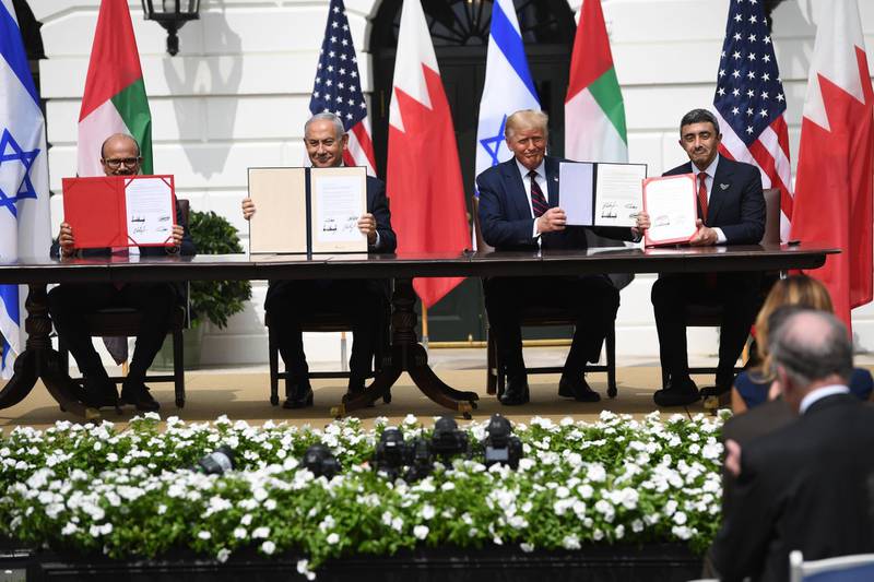 Sheikh Abdullah and, from left, Mr Al Zayani, Mr Netanyahu and Mr Trump after the signing ceremony. AFP