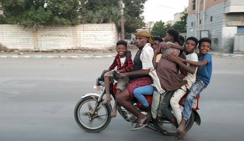 A Yemeni man and his children on a street in the western city of Hodeidah, Yemen. EPA