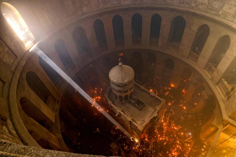 Christians participate in the Holy Fire ceremony at the Church of the Holy Sepulchre, in Jerusalem's Old City, on April 23. AFP