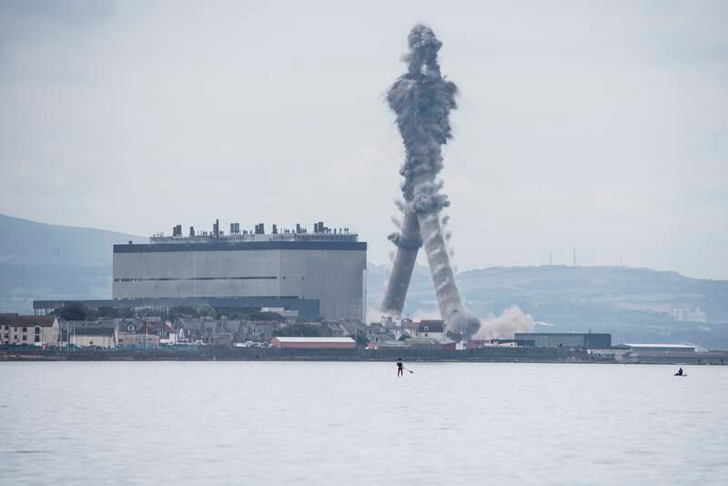The landmark chimneys at Scotland's Cockenzie power station being demolished on September 26, 2015.