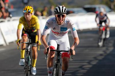 Tadej Pogacar finishes ahead of overall race leader Primoz Roglic to win the stage. Reuters