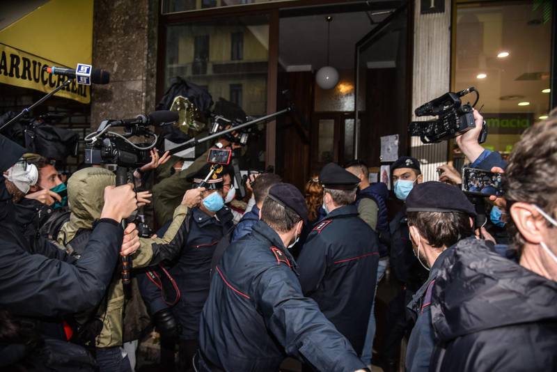A crowd of journalists and residents wait for the arrival of Silvia Romano, in Milan, Italy.  EPA
