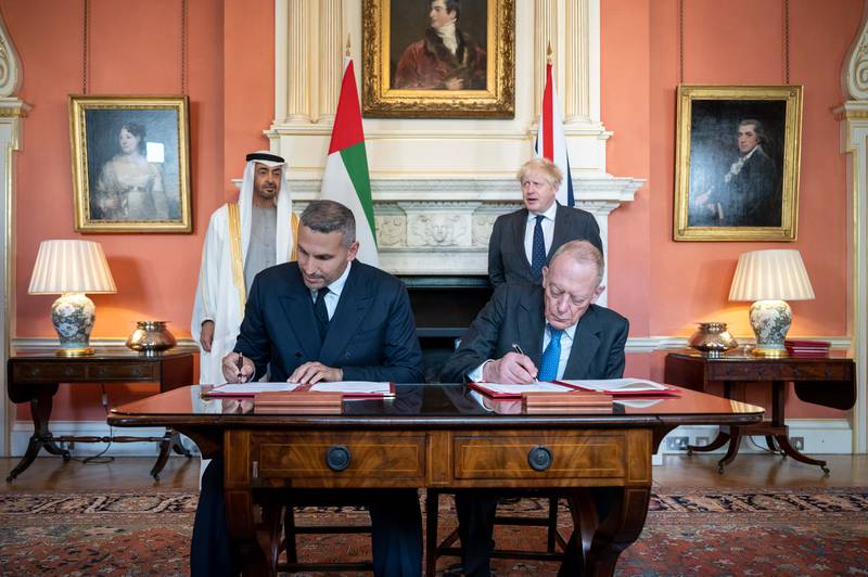 Sheikh Mohamed bin Zayed and Prime Minister Boris Johnson witness the signing of key agreements between the UAE and the UK. Ministry of Presidential Affairs
