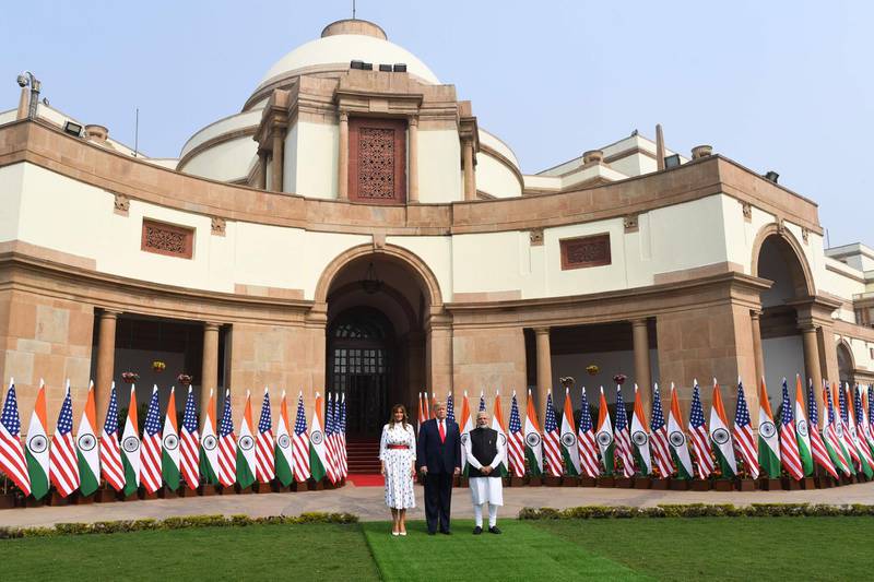 India's Prime Minister Narendra Modi, US President Donald Trump and First Lady Melania Trump pose before a meeting at Hyderabad House in New Delhi. AFP