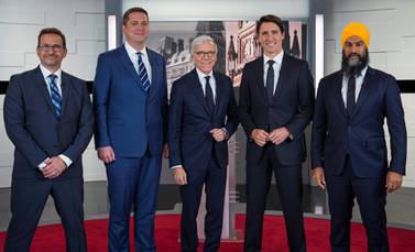 Bloc Quebecois leader Yves-François Blanchet, Conservative leader Andrew Scheer, TVA network host Pierre Bruneau, Liberal leader and Prime Minister Justin Trudeau and NDP leader Jagmeet Singh pose before a French language debate, October 2, 2019. Reuters