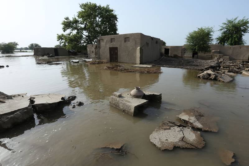 John Kerry cited the floods in Pakistan as an example of the effects of global warming. AFP

