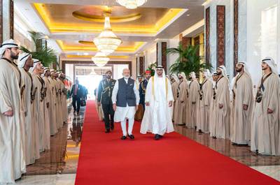 A handout image provided by the United Arab Emirates News Agency (WAM) on August 24, 2019,  shows Mohamed bin Zayed al-Nahyan (R), Crown Prince of Abu Dhabi and Deputy Supreme Commander of the UAE Armed Forces (R) and Indian Prime Minister Narendra Modi (L), reviewing honour guard in the UAE capital. === RESTRICTED TO EDITORIAL USE - MANDATORY CREDIT "AFP PHOTO / HO / WAM" - NO MARKETING NO ADVERTISING CAMPAIGNS - DISTRIBUTED AS A SERVICE TO CLIENTS ===
 / AFP / WAM / STRINGER / === RESTRICTED TO EDITORIAL USE - MANDATORY CREDIT "AFP PHOTO / HO / WAM" - NO MARKETING NO ADVERTISING CAMPAIGNS - DISTRIBUTED AS A SERVICE TO CLIENTS ===
