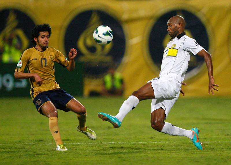 Rami Yaslam of Dubai (left) and Shikabala of Al Wasl fight for the ball during the Etisalat Pro League match between Dubai and Al Wasl at Dubai Sports & Cultural club Stadium, Dubai on the 9th November 2012. Credit: Jake Badger for The National