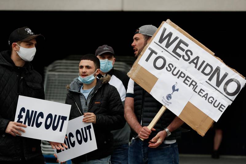 Tottenham fans hold banners protesting against the board outside the stadium before the match against Southampton. Reuters