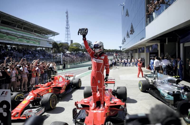 Formula One F1 - Brazilian Grand Prix 2017 - Sao Paulo, Brazil - November 12, 2017  Ferrari's Sebastian Vettel celebrates winning the race  REUTERS/Ueslei Marcelino - RC1551616390