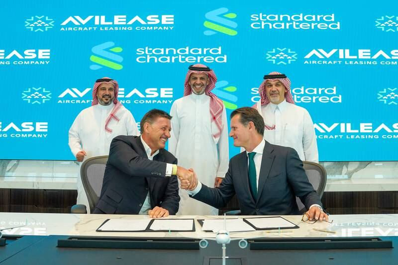 AviLease chief executive Edward O'Byrne (from right, seated) and Simon Cooper, chief executive of corporate, commercial and institutional banking and Europe and Americas at Standard Chartered, during the signing of agreement. Photo: AviLease
