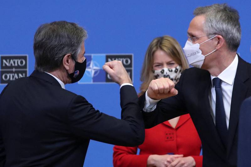 US Secretary of State Antony Blinken and NATO Secretary General Jens Stoltenberg bump elbows at the end of a debate at a NATO Foreign Ministers' meeting at the Alliance's headquarters in Brussels, Belgium. AFP