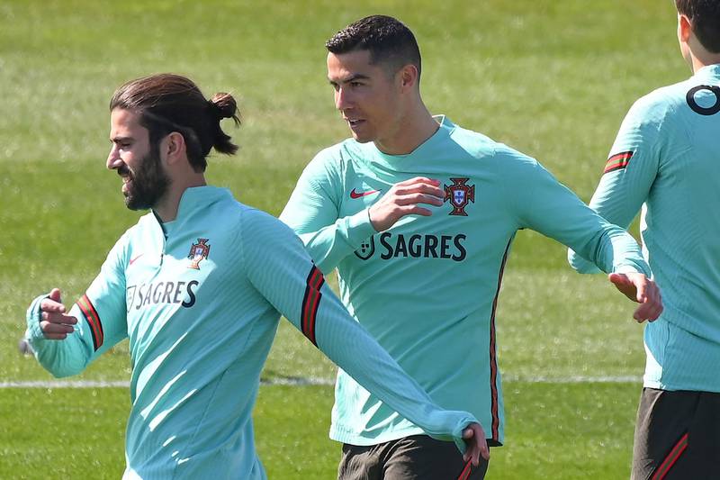 Cristiano Ronaldo and midfielder Sergio Oliveira training ahead of Portugal's World Cup qualifers against Azerbaijan, Serbia and Luxembourg. AFP