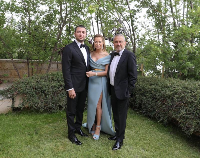 Elie Saab Jr with his parents at the religious ceremony - Claudine's dress here has to be our favourite of the whole festivities. Photo: ParAzar 