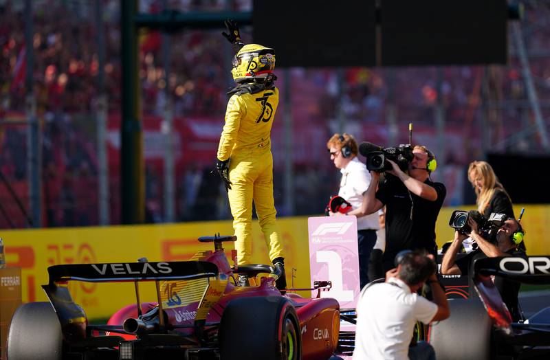Ferrari's Charles Leclerc celebrates after claiming pole. PA