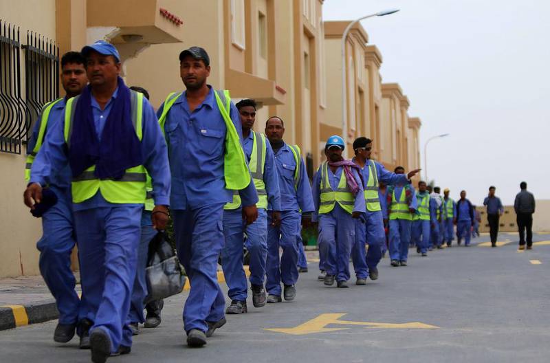 File photo of foreign labourers in Doha working at the construction site of the Al Wakrah football stadium, one of the Qatar's 2022 World Cup stadiums. Qatar has abolished the kafala sponsorship system. Marwan Naamani/AFP Photo