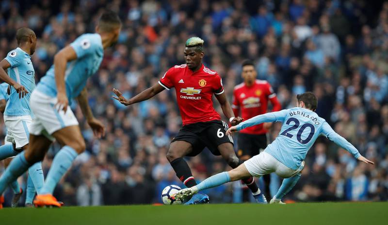 Soccer Football - Premier League - Manchester City vs Manchester United - Etihad Stadium, Manchester, Britain - April 7, 2018   Manchester United's Paul Pogba in action with Manchester City's Bernardo Silva                   Action Images via Reuters/Lee Smith    EDITORIAL USE ONLY. No use with unauthorized audio, video, data, fixture lists, club/league logos or "live" services. Online in-match use limited to 75 images, no video emulation. No use in betting, games or single club/league/player publications.  Please contact your account representative for further details.