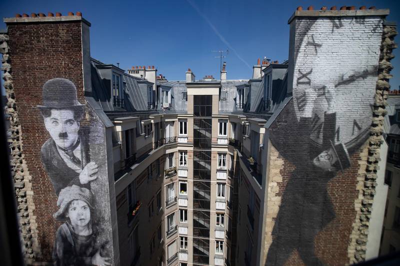 epaselect epa09167312 A work of art by French artist JR  adorns the side of a building, seen from a hotel room in the new Hotel Paradiso, in Paris, France, 27 April 2021 (issued 29 April 2021). The Hotel Paradiso is a boutique hotel created in collaboration with french cinema chain MK2, merging the hotel and movie theatre experiences. As part of nationwide lockdown measures in place to curb the spread of Covid19 coronavirus, cinemas across France have remained closed for months. Paris hotels have also suffered an economic downturn, as international travel dwindled with the ongoing pandemic crisis. The Hotel Paradiso aims to attract clientele based on its cinema-centric environment by offering its customers a privatized cinematic experience. Rooms and suites are equipped with home-cinemas, and the hotel has access to fully privatized cinema rooms.  EPA-EFE/IAN LANGSDON