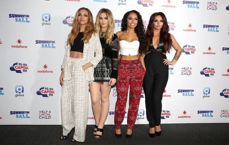 Jesy Nelson, in a black jumpsuit with a leather top, with her Little Mix bandmates at the Capital Summertime Ball on June 21, 2014 in London