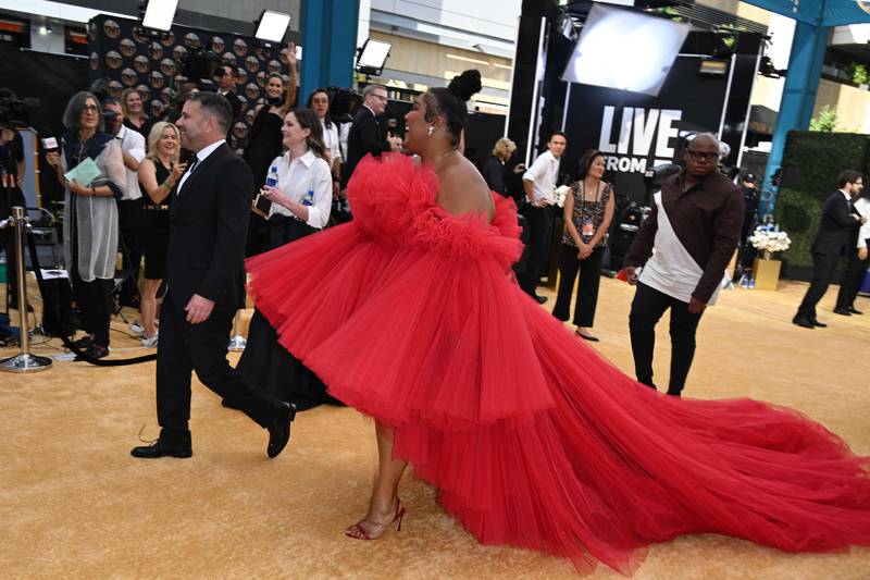 Lizzo in a red tulle gown with Lorraine Schwartz jewellery. AFP