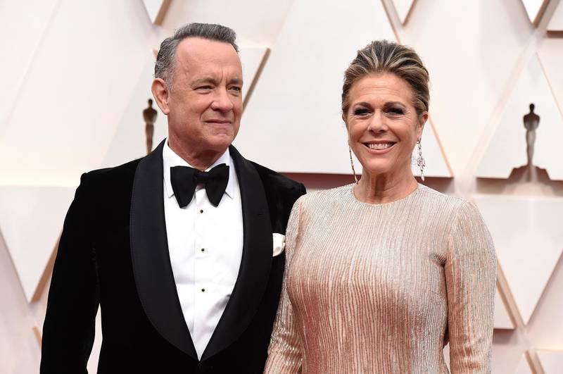FILE - In this Feb. 9, 2020 file photo, Tom Hanks, left, and Rita Wilson arrive at the Oscars at the Dolby Theatre in Los Angeles. The couple have tested positive for the coronavirus, the actor said in a statement Wednesday, March 11. The 63-year-old actor said they will be "tested, observed and isolated for as long as public health and safety requires." (Photo by Jordan Strauss/Invision/AP, File)