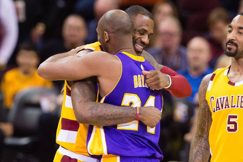 LeBron James greets Bryant on the court. AP