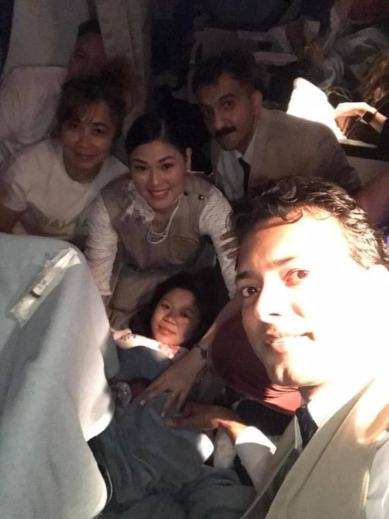 Sheryl Frigillana, centre, who gave birth on a Kuwait Airways flight from Kuwait City to Philippines capital Manila, surrounded by nurse Sheryl Pascua, left, and cabin crew. All photos: Sheryl Alipio Pascua