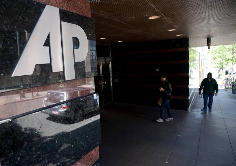 epa03700099 The Associated Press (AP) logo is seen at the entrance to their office building in New York, New York , USA, 14 May 2013. US officials improperly seized records for 20 telephone numbers of Associated Press journalists, the news agency alleged in a letter 13 May to the Justice Department. The records were obtained secretly last year during a two-month period and include a list of calls made from numbers at the agency's New York headquarters as well as offices in Washington and Connecticut and home and mobile phone numbers of reporters, AP chief executive Gary Pruitt wrote in a letter to US Attorney General Eric Holder.  EPA/ANDREW GOMBERT