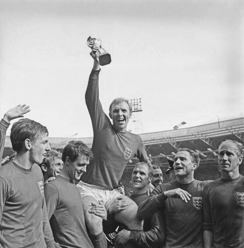 England captain Bobby Moore holds up the Jules Rimet trophy after the 4-2 victory over West Germany in the World Cup final at the Wembley Stadium in London on July 30, 1966. Getty