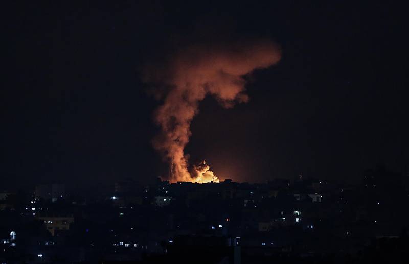 Smoke and flames rise after an Israeli air strike in northern Gaza early on Friday. Gaza’s Health Ministry said 109 Palestinians, including 28 children and 15 women, had been killed by air strikes. EPA
