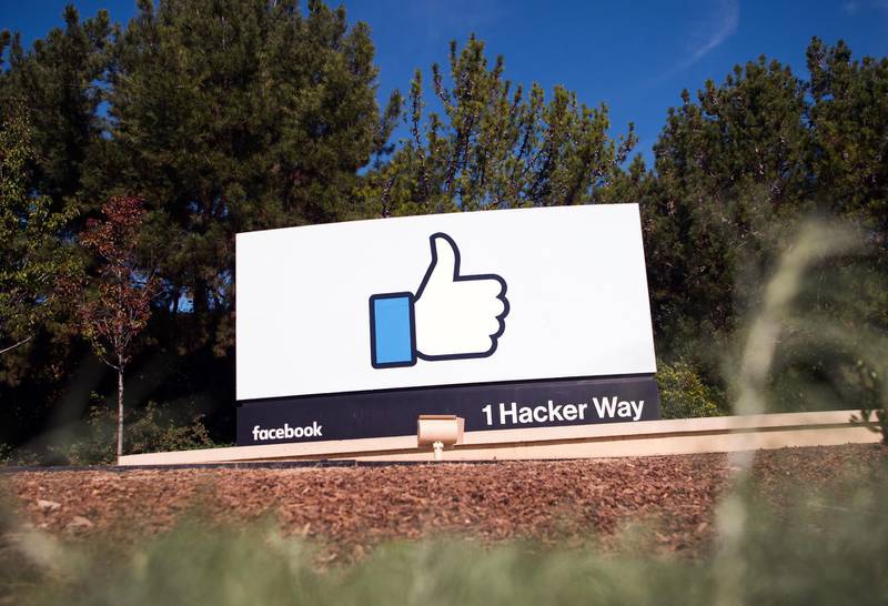 (FILES) This file photo taken on November 4, 2016 shows the Facebook sign and logo in Menlo Park, California. 
Facebook acknowledged on january 22, 2018, that the explosion of social media poses a potential threat to democracy, pledging to tackle the problem head-on and turn its powerful platform into a force for "good." The comments from the world's biggest social network were its latest response to intense criticism for failing to stop the spread of misinformation among its two billion users -- most strikingly leading up to the 2016 US election.
 / AFP PHOTO / JOSH EDELSON
