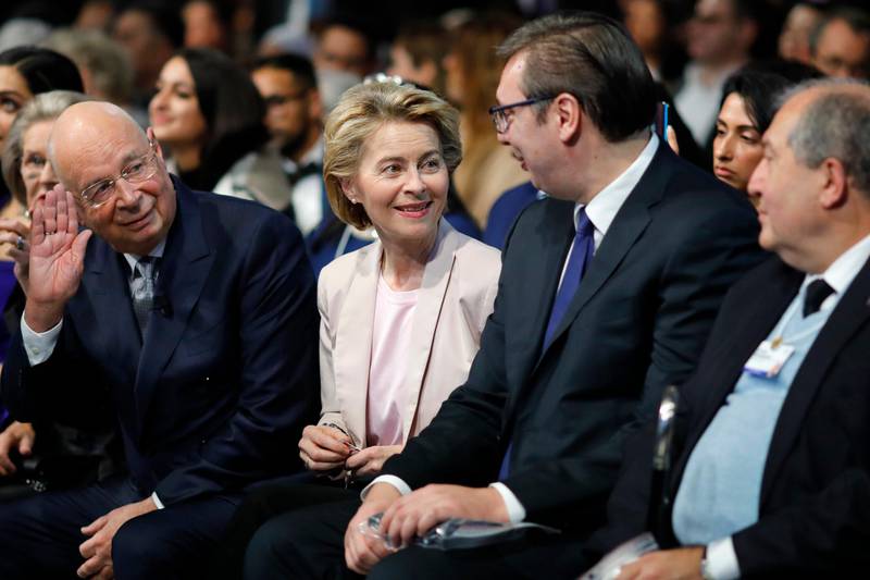 Klaus Schwab, founder and Executive Chairman of the World Economic Forum, left, gestures while European Commission President Ursula von der Leyen talks with Serbia's President Aleksandar Vucic, second right, during a celebration of the 50th anniversary of the World Economic Forum in Davos, Switzerland. AP Photo