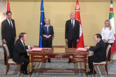 Netherlands Prime Minister Mark Rutte, European Commission President Ursula Von der Leyen, Tunisian President Kais Saied and Italy's Prime Minister Giorgia Meloni watch the preliminary agreement signing in Tunis on July 16. AFP
