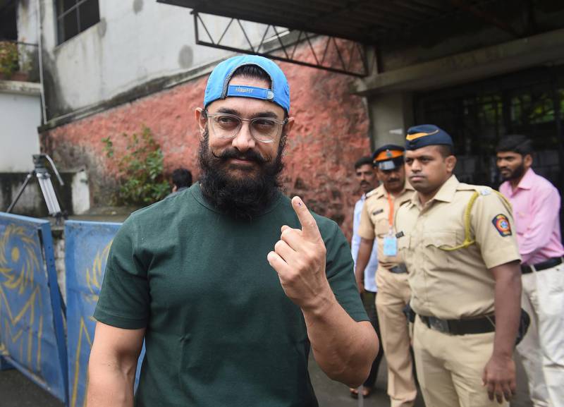 Bollywood actor Aamir Khan shows a ink mark on his index finger after casting his vote outside a polling station in Mumbai, Monday, Oct., 21, 2019. Polling is being held to elect Indian states of Maharashtra and Haryana assemblies with the ruling Bharatiya Janata Party and its allies seeking to retain power in the two states on the back of the recent general elections victory. AP