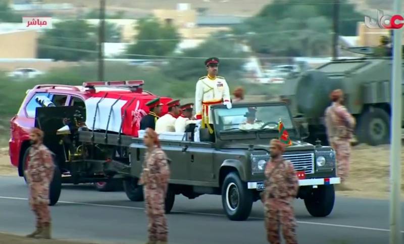 A motorcade carries the body of Sultan Qaboos. Oman TV via AP