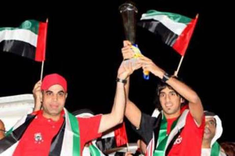 ABU DHABI . NOV.15th 2008. The victorious UAE under 19's football team arrive at Abu Dhabi airport last night (sat) after winning the Asian Football Confederation Under 19's Championship in Saudi Arabia. With Captain Hamdan al Kamali(right) and coach Mahdy Ali .Stephen Lock  /  The National. 