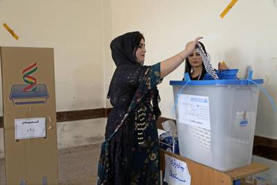 A Kurdish woman in traditional clothes prepares to vote during the Kurdistan parliamentary election at a polling station in Erbil, the capital of the Kurdistan Region in Iraq. With over three million people eligible to vote, the semi-autonomous region is voting on its parliamentary elections a year after a failed bid for independence from Iraq.  EPA