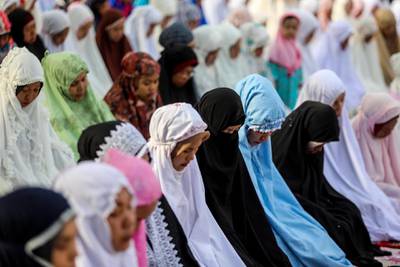 Indonesians pray during an Eid Al Adha prayer service in Medan, Indonesia.  EPA