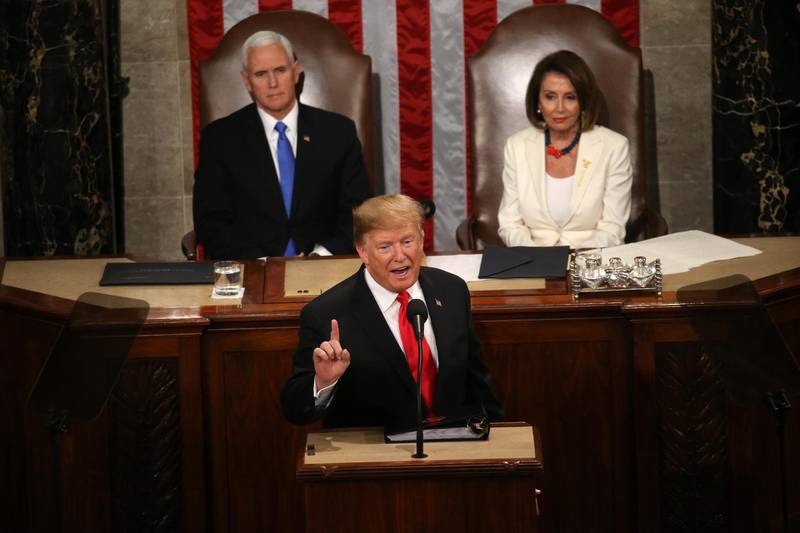 Mike Pence and Nancy Pelosi listen as Donald Trump delivers his second State of the Union address. Reuters