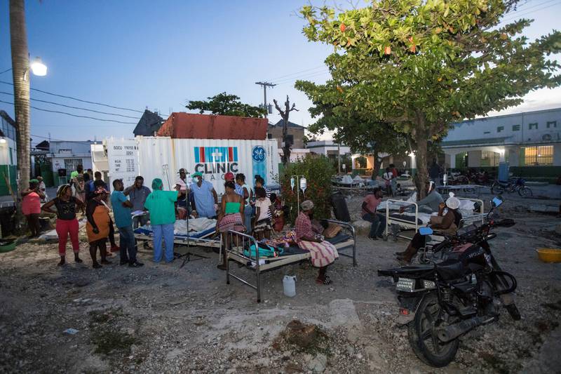 Patients are accompanied by their relatives outside a hospital damaged by the 7.2 magnitude earthquake in Les Cayes, Haiti. Reuters