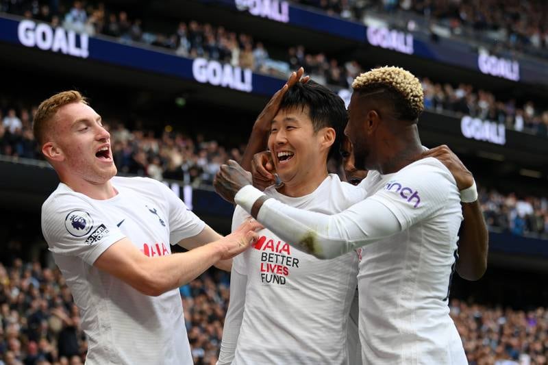 Son Heung-Min celebrates with Dejan Kulusevski and Emerson Royal after scoring the third. Getty