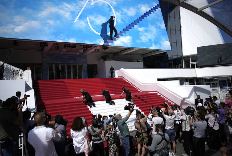 Crew members install the red carpet at the Palais des Festivals, ahead of the opening day of the 75th Cannes Film Festival. AP Photo