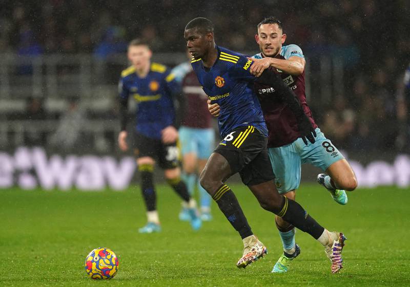 Paul Pogba and Burnley's Josh Brownhill battle for the ball 