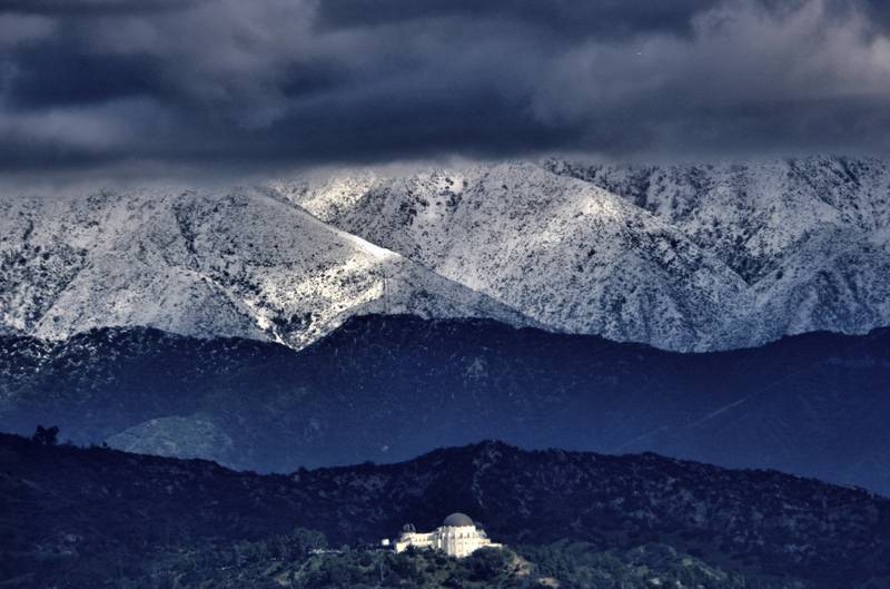 Clouds gather over the San Gabriel mountain range in southern California, as a powerful winter storm heads for Los Angeles. AP

