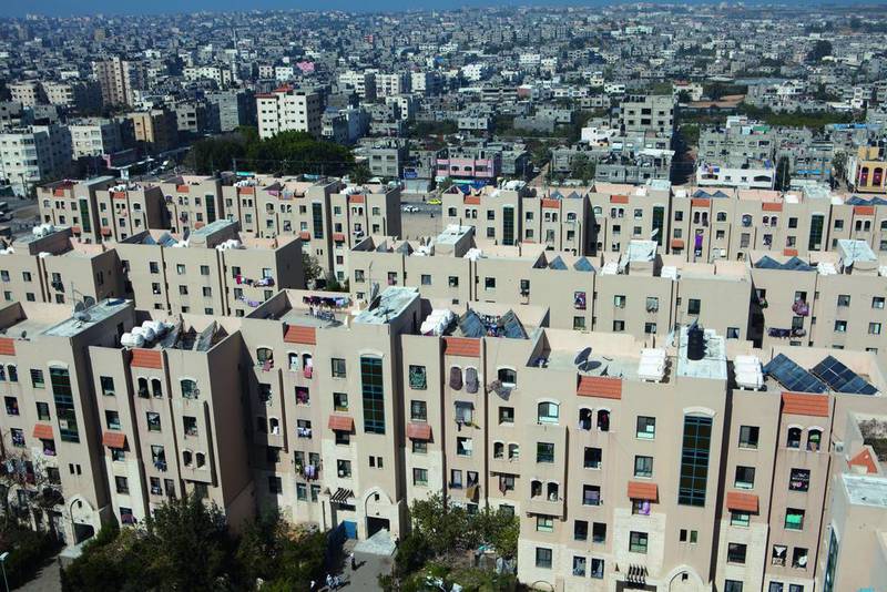 An overview showing part of the Sheikh Zayed City charity housing project against the skyline of the densely populated Gaza Strip. Heidi Levine for The National