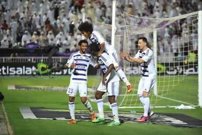 Omar Abdulrahman jumps on the back of Asamoah Gyan after the Ghana international scores the only goal of their game against Al Jazira. Abdulrahman, the UAE playmaker, was not at his usual best. Imran Shahid / Al Ittihad