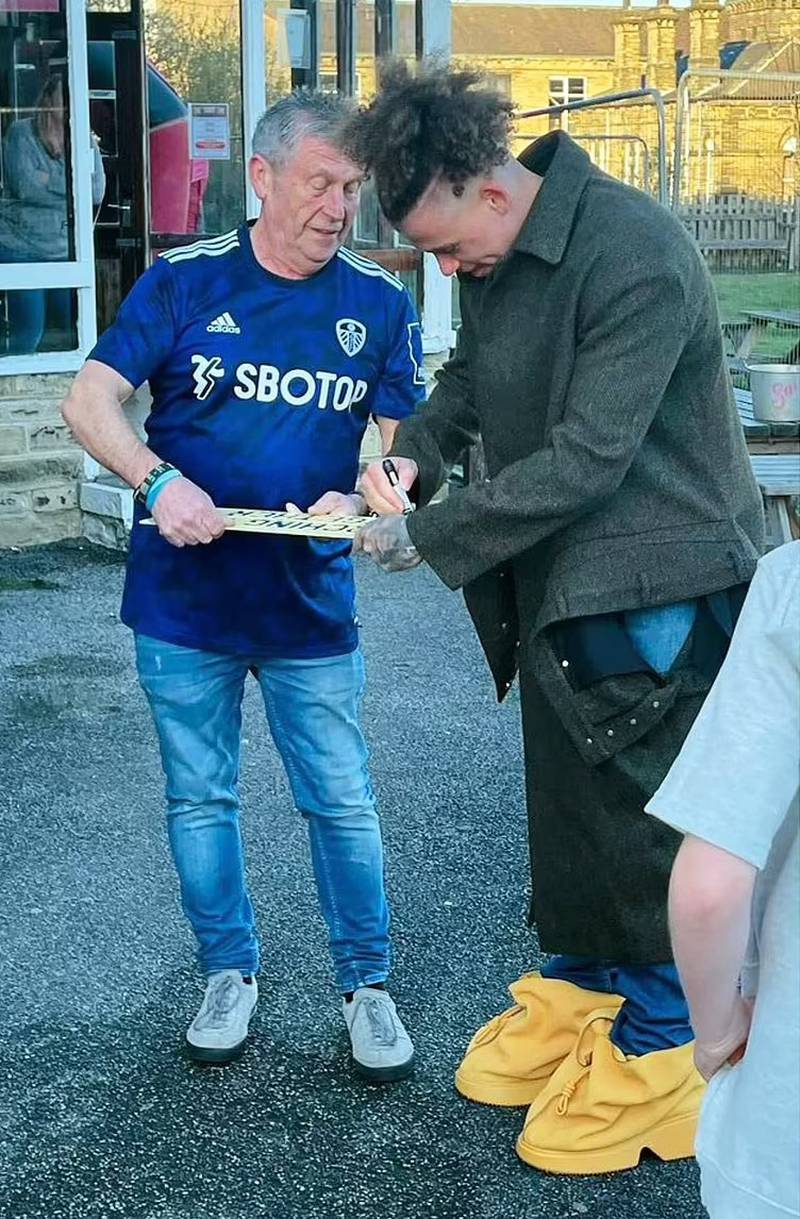 No 1 - dodgy boot deal: Leeds and England midfielder Kalvin Philips greets a fan in his 'Quaver' boots. Twitter