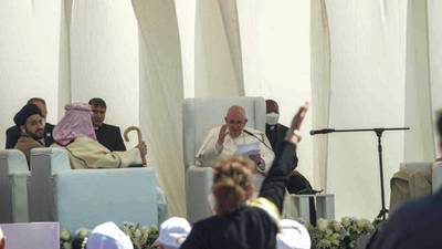 Pope Francis smiles and waves at a women that threw a kiss to him. Haider Husseini/ The National