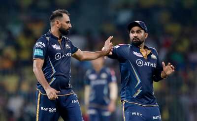 Gujarat Titans bowler Mohammad Shami celebrates with teammates after taking the wicket of Devon Conway of Chennai. Getty 