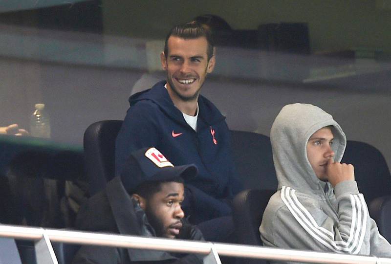 Tottenham Hotspur's Gareth Bale, Juan Foyth and Japhet Tanganga in the stands during the match against Newcastle. Reuters